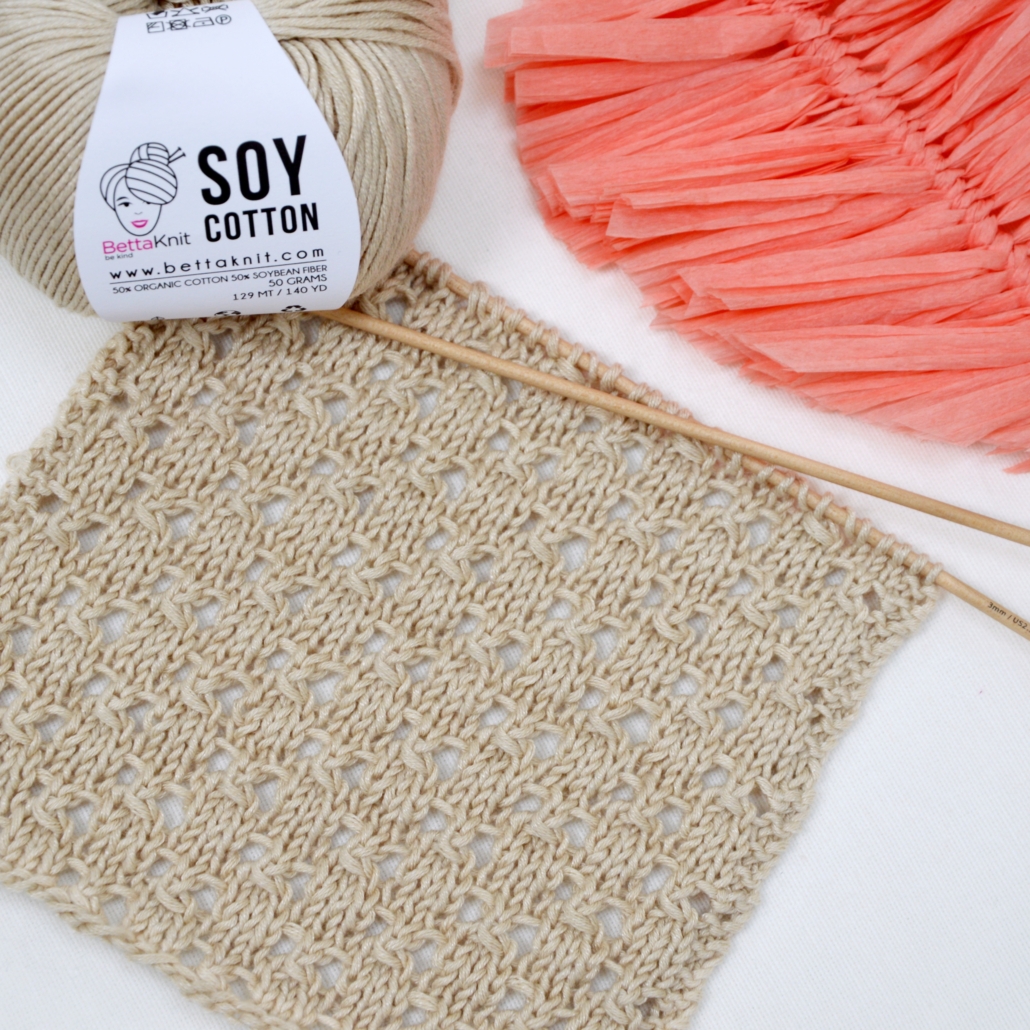 The Tiny Squares Eyelet Stitch is an easy and versatile knitting stitch. This design consists in little squares alternating in rows with little holes, which are created by making yarn over stitches while knitting. The final result is a subtle and delicate pattern. This is a perfect stitch for both cotton and wool yarns, especially to make pullovers and scarves.